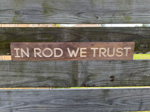 In Rod We Trust sign