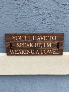 You'll have to speak up, I'm wearing a towel sign