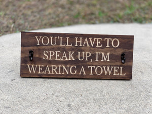 You'll have to speak up, I'm wearing a towel sign